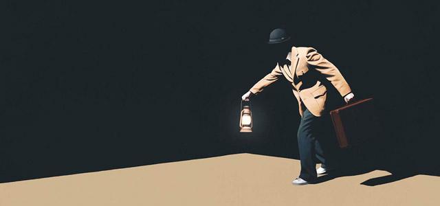 A person in a suit and hat holding a lantern and briefcase while walking through a dark setting.